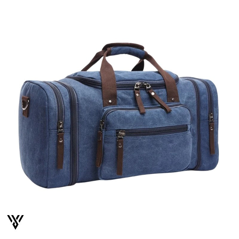 NomadVault Travel Bag, men's canvas duffel in blue, durable and spacious for weekend and outdoor use - VAYOME.