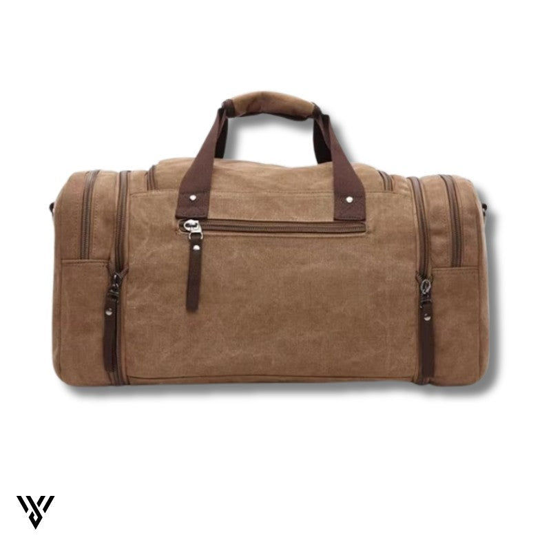 NomadVault Canvas Duffel Bag, men's outdoor travel bag in brown, detailed back side view - VAYOME.