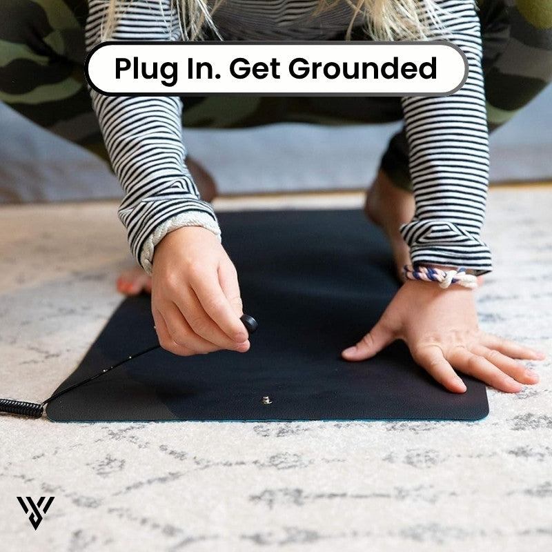 CoreBalance Grounding Mat, image showing the connection of the plug to the mat, instructing to plug in and get grounded - VAYOME.