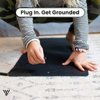 CoreBalance Grounding Mat, image showing the connection of the plug to the mat, instructing to plug in and get grounded - VAYOME.
