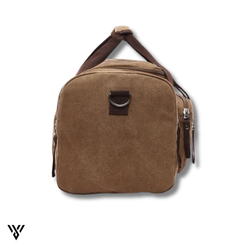NomadVault Canvas Duffel Bag, men's outdoor travel bag in brown, showing left and right side pockets - VAYOME.