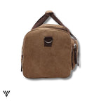 NomadVault Canvas Duffel Bag, men's outdoor travel bag in brown, showing left and right side pockets - VAYOME.