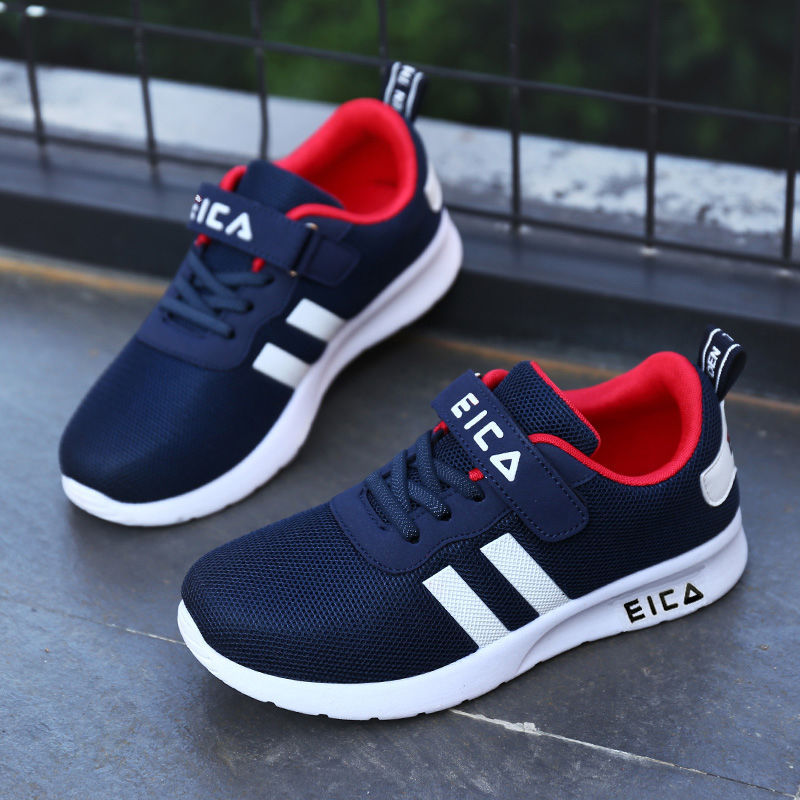 Navy blue and red athletic shoes with white stripes on a dark surface.