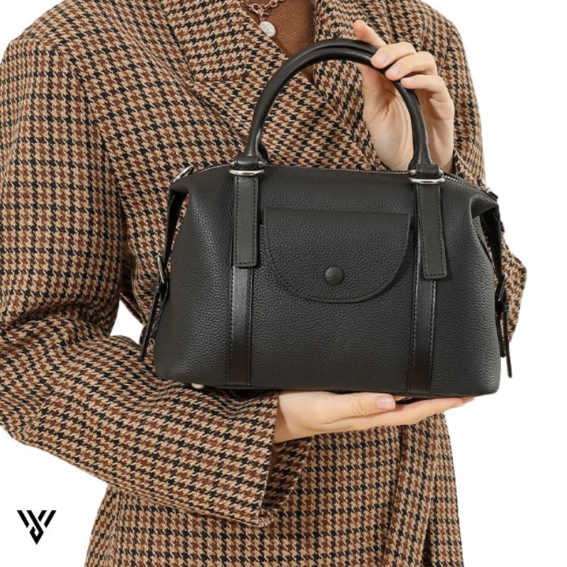 Versatile Contrast Leather Lock Bag for women, a model holding the stylish shoulder/handbag in Black color - VAYOME.